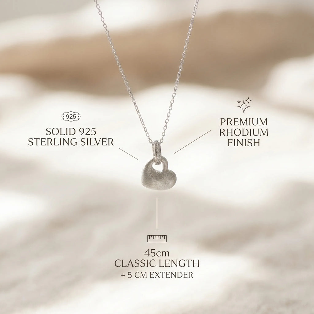 Feature breakdown of rhodium silver puffed heart pendant earring set — 925 silver, dimensions and post-back