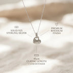 Feature breakdown of rhodium silver puffed heart pendant earring set — 925 silver, dimensions and post-back