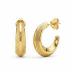 Ribbed 18K gold vermeil crescent moon hoop earrings displayed on a white background in Dubai.