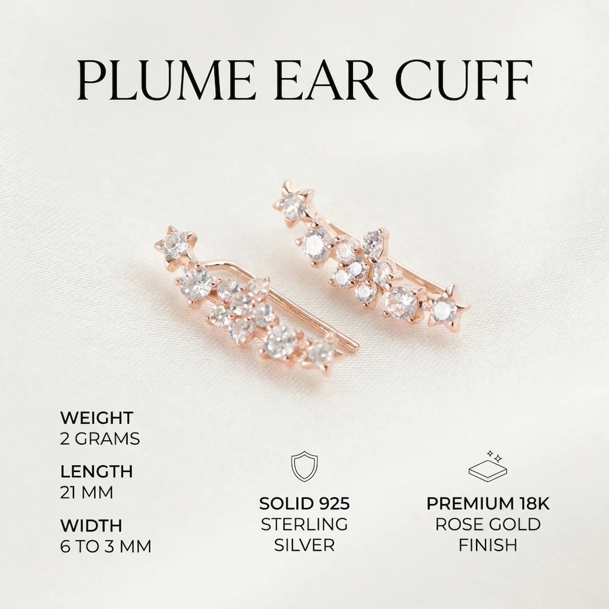 Technical infographic for the rose gold plume ear climbers highlighting the 21mm length, 2g weight, 925 silver core, and CZ stones.