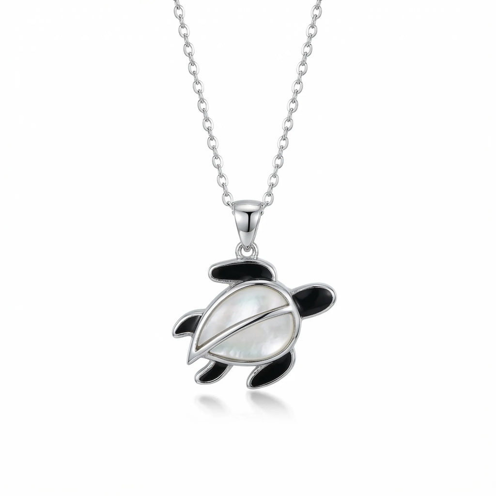Sea turtle pendant necklace in 925 sterling silver with Mother of Pearl shell and black enamel flippers, white background