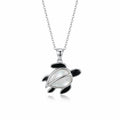 Sea turtle pendant necklace in 925 sterling silver with Mother of Pearl shell and black enamel in Dubai, white background.