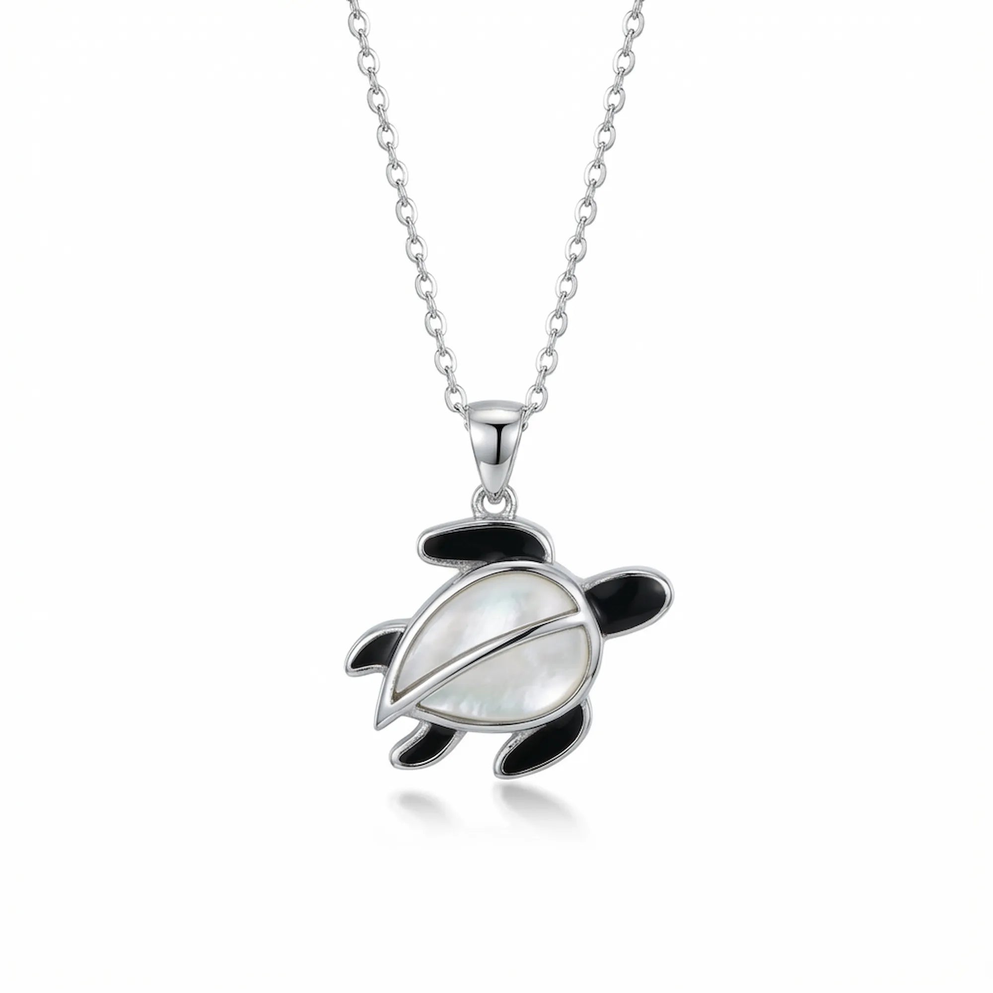 Sea turtle pendant necklace in 925 sterling silver with Mother of Pearl shell and black enamel flippers, white background