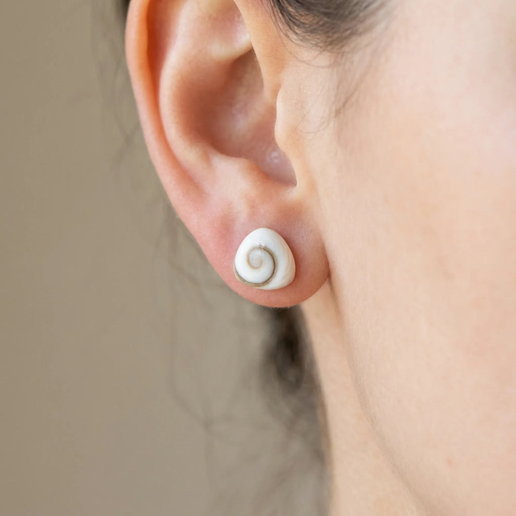 Natural Shiva Eye shell silver stud worn on the ear, 925 sterling silver post-back, Dubai UAE