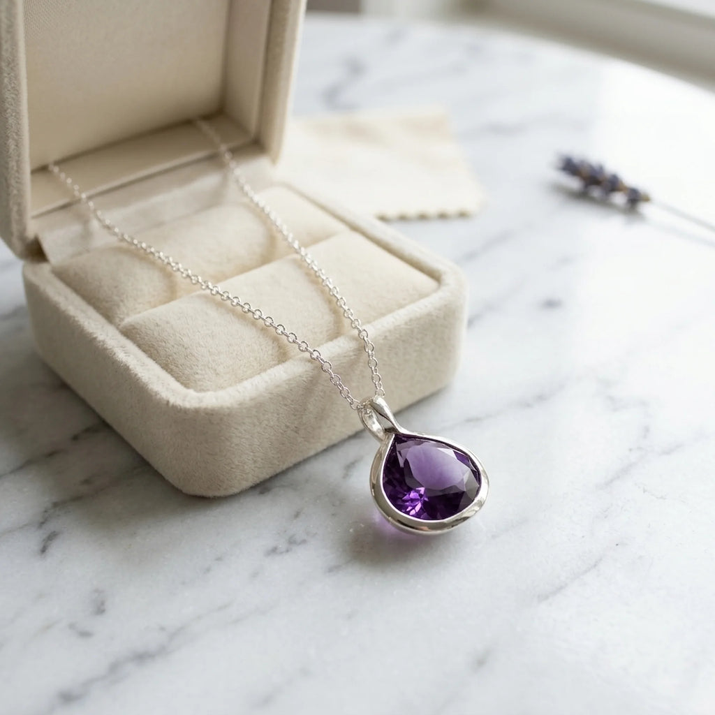Natural amethyst lotus pendant necklace in 925 sterling silver resting on a velvet jewellery box in Dubai.