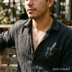 Man wearing a Made in Italy silver crucifix necklace with small polished cross and cable chain