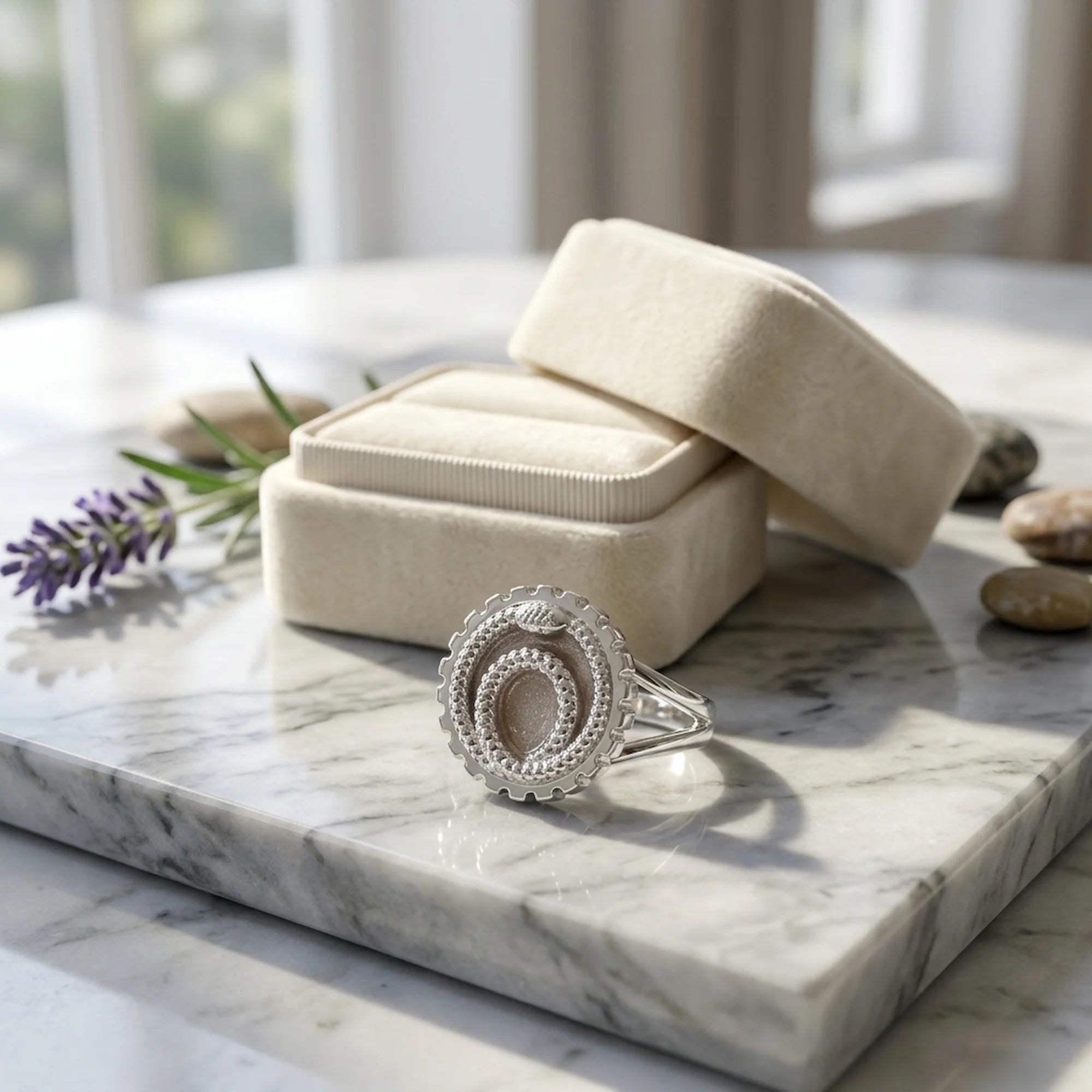 Charcoal silver enamel ouroboros snake signet ring in 925 sterling silver displayed by a jewellery box in Dubai.