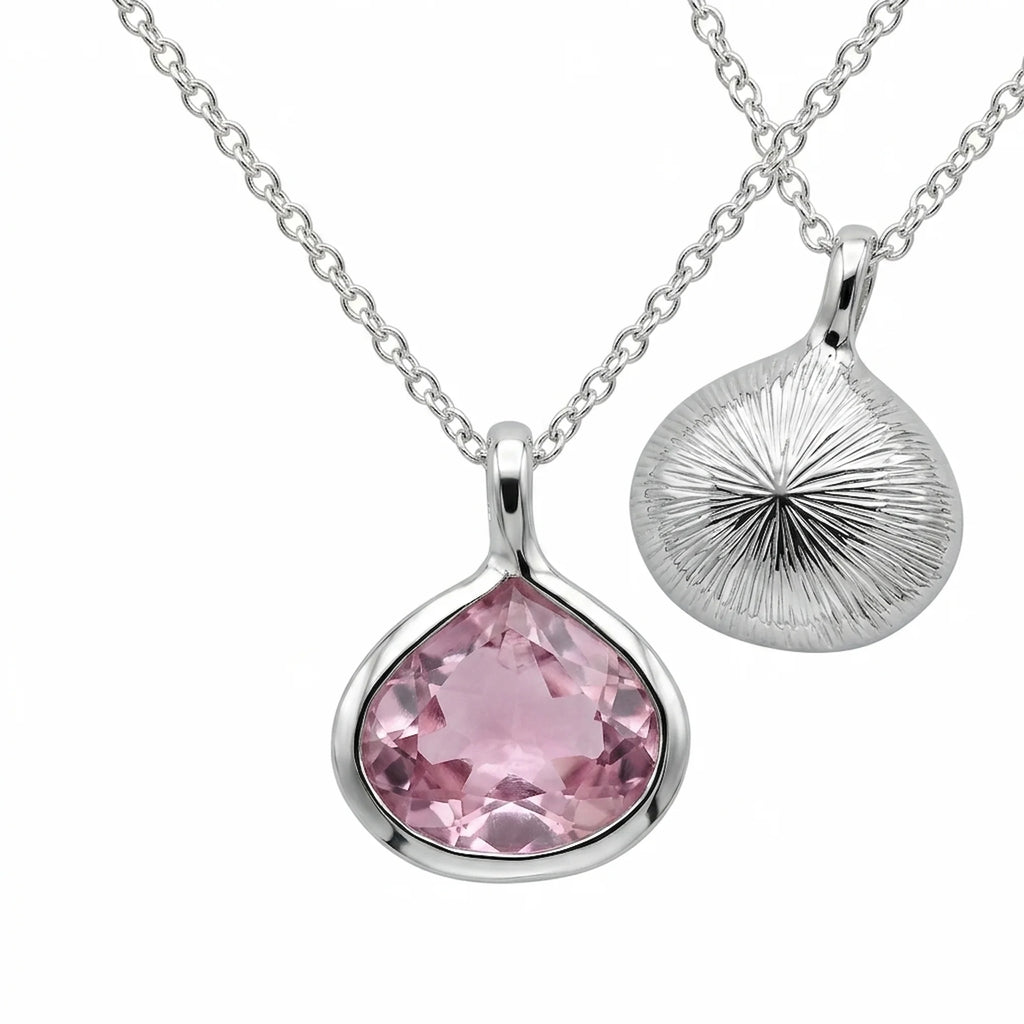 Reversible 925 silver lab-grown pink sapphire lotus pendant necklace showing front and sunburst back, hand made in Dubai.