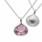 Reversible 925 silver lab-grown pink sapphire lotus pendant necklace showing front and sunburst back, hand made in Dubai.