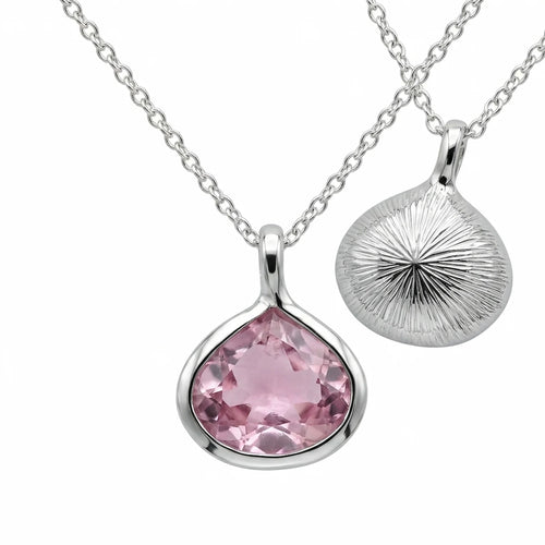 Reversible 925 silver lab-grown pink sapphire lotus pendant necklace showing front and sunburst back, hand made in Dubai.