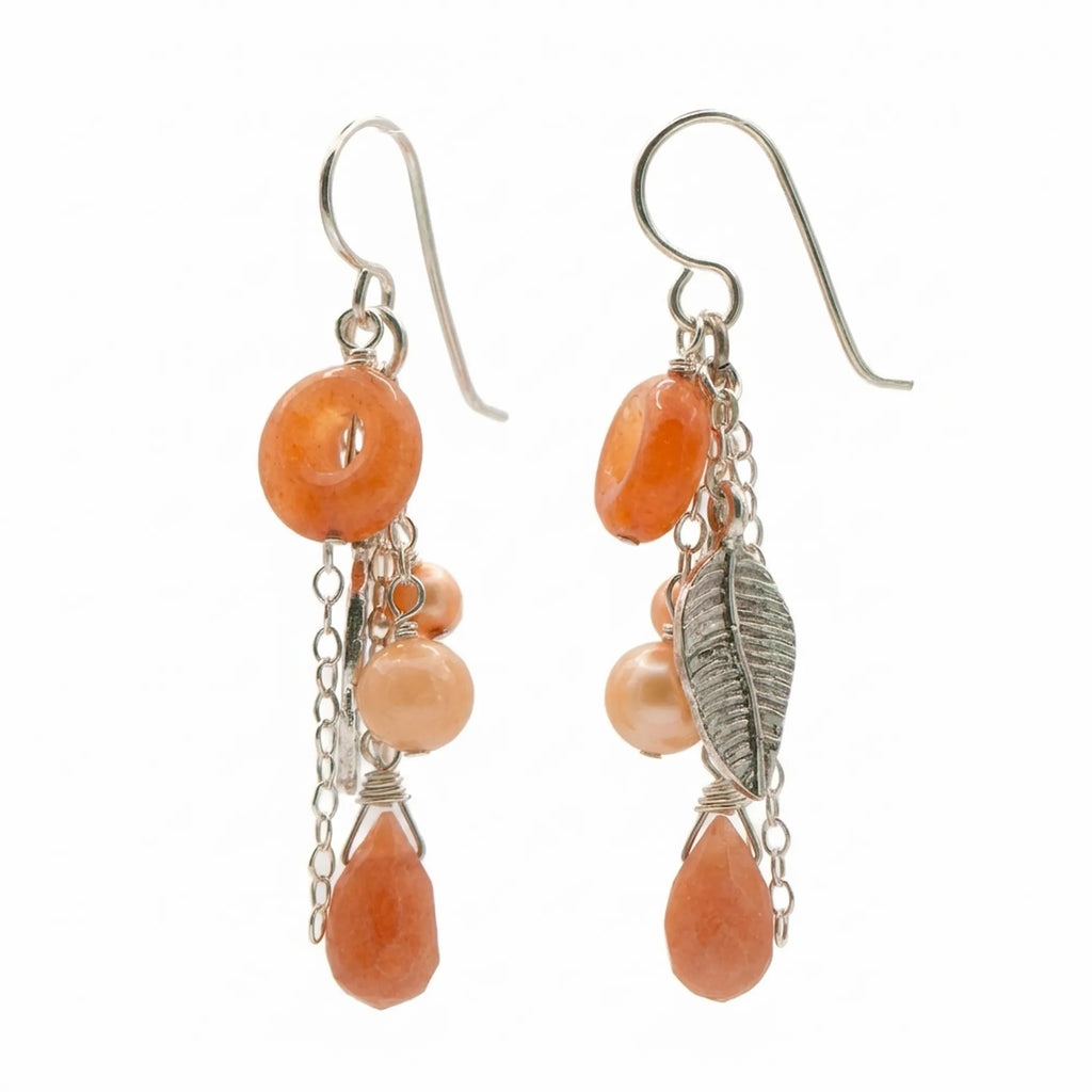 Shop the warm Matte Peach Harvest Cascade silver leaf chain drop earrings made of 925 sterling silver and semiprecious stones.
