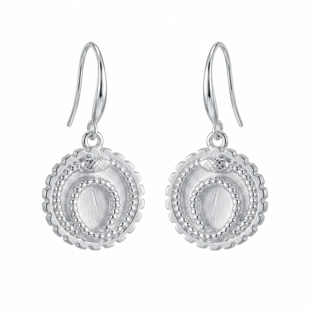 Front view of silver ouroboros snake drop earrings in 925 sterling silver with a cog border, handcrafted in Dubai.