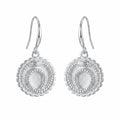 Front view of silver ouroboros snake drop earrings in 925 sterling silver with a cog border, handcrafted in Dubai.