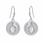 Front view of silver ouroboros snake drop earrings in 925 sterling silver with a cog border, handcrafted in Dubai.