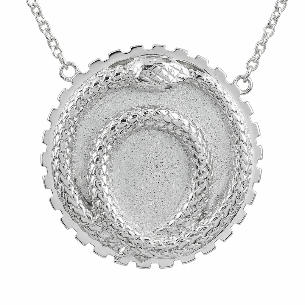 Silver ouroboros snake pendant crafted in 925 sterling silver with a toothed cog border, a milestone gift in Dubai.
