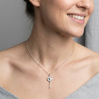 Woman wearing rhodium plated 925 sterling silver heart-and-key pendant necklace in Dubai.