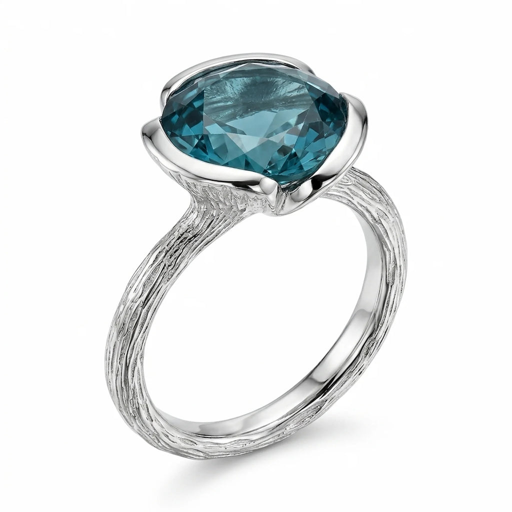 Front view of the 925 sterling silver sky blue topaz lotus cocktail ring with a branch-textured shank in Dubai.