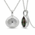 Reversible 925 sterling silver watermelon tourmaline simulant lotus pendant showing the engraved sunburst, Dubai.