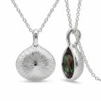 Reversible 925 sterling silver watermelon tourmaline simulant lotus pendant showing the engraved sunburst, Dubai.