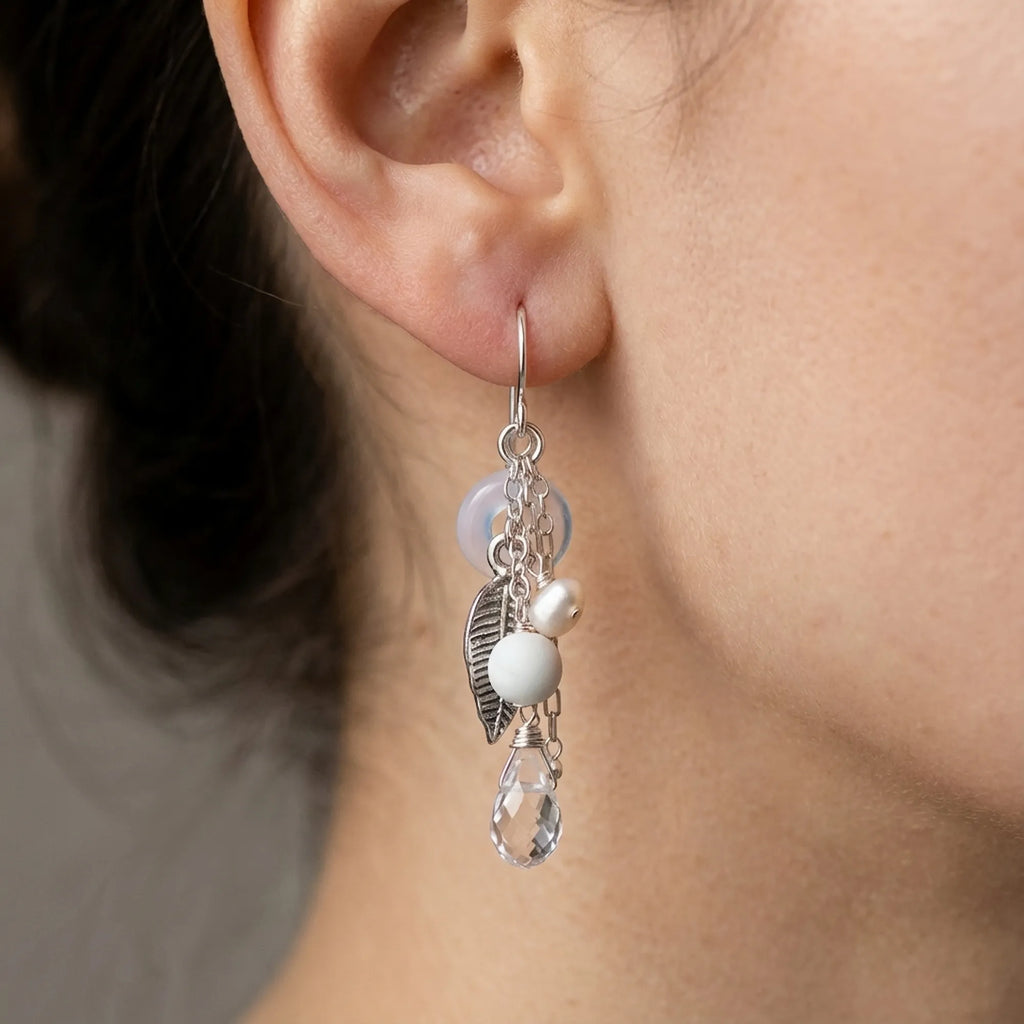See the exact length and elegant drape of these beautiful 925 sterling silver leaf chain drop earrings with snow quartz worn on an ear.