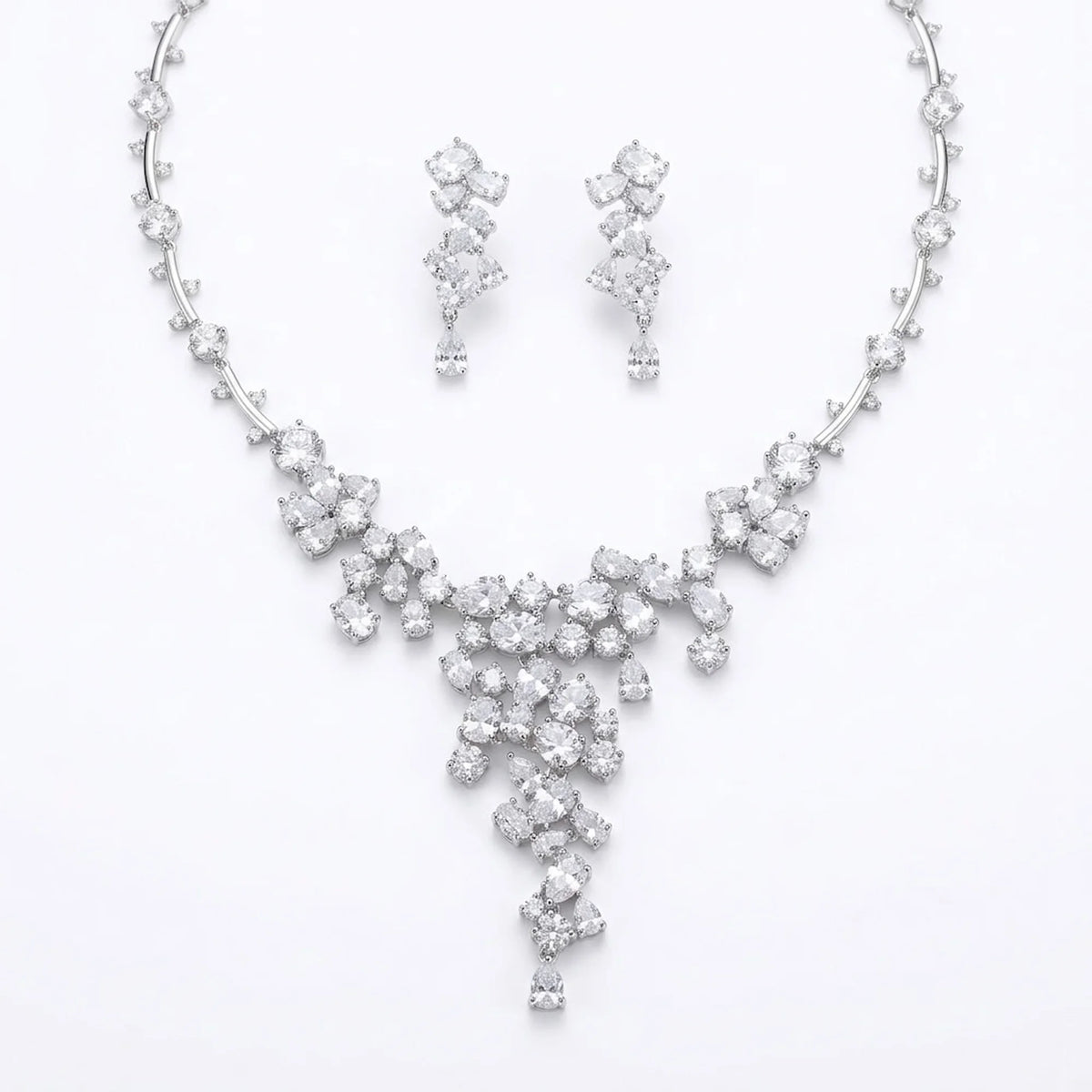 Statement waterfall Y-necklace and earrings set in rhodium-plated cubic zirconia, displayed on a white background in Dubai.