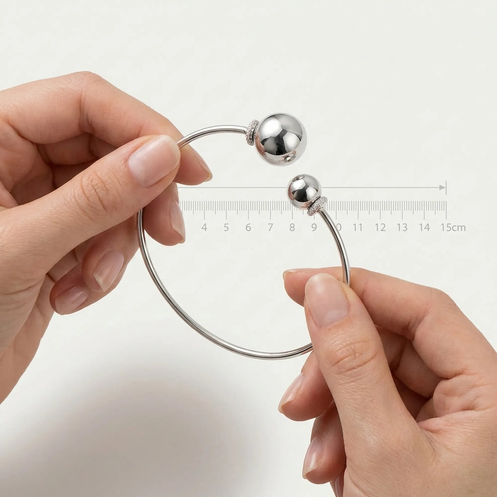 Hands holding the open cz sterling silver choker next to a ruler showing the 15cm width for accurate size reference.