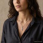 Woman wearing an ornate sterling silver crucifix necklace with included Venetian box chain.