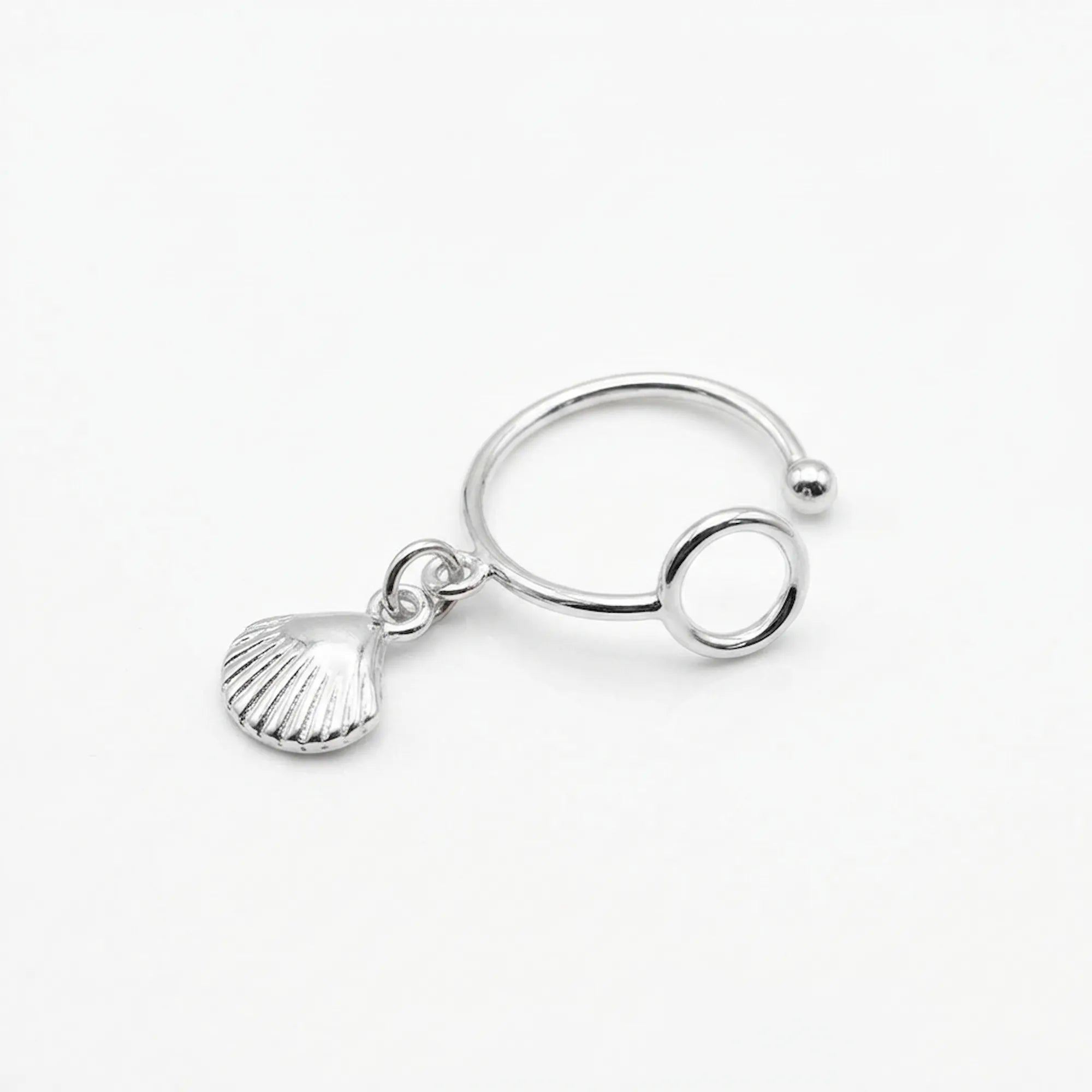 Close-up upright angle of the sterling silver ear cuff no piercing, showcasing the bright polish finish and the secure circular grip.