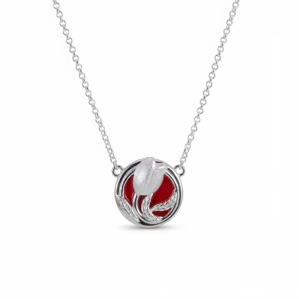 Red tulip pendant necklace in brushed sterling silver on a white background. Hand-enameled floral jewelry for women.
