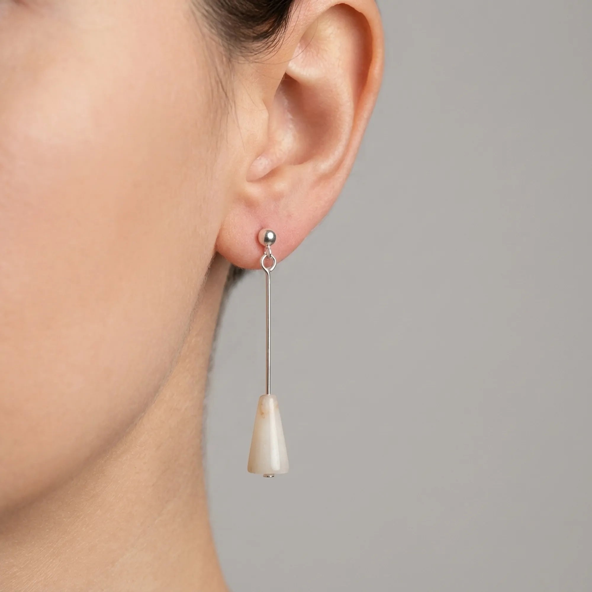 Natural Sunset Onyx silver drop earring worn on the ear, 50 mm sterling silver rod, Dubai UAE