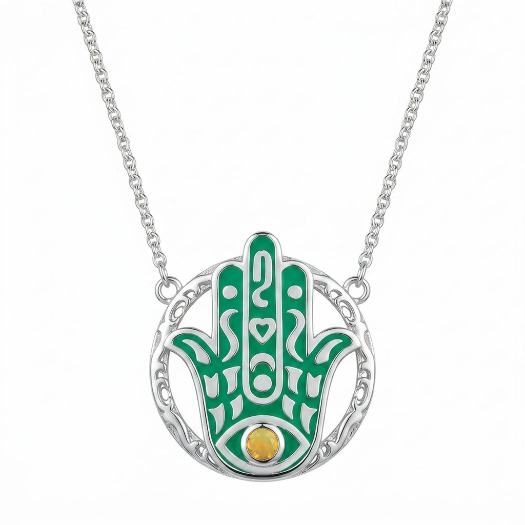 Teal enamel Hamsa hand pendant necklace in 925 sterling silver with a natural yellow opal eye, Luna Dura Dubai.