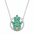 Teal enamel Hamsa hand pendant necklace in 925 sterling silver with a natural yellow opal eye, Luna Dura Dubai.