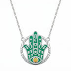 Teal enamel Hamsa hand pendant necklace in 925 sterling silver with a natural yellow opal eye, Luna Dura Dubai.