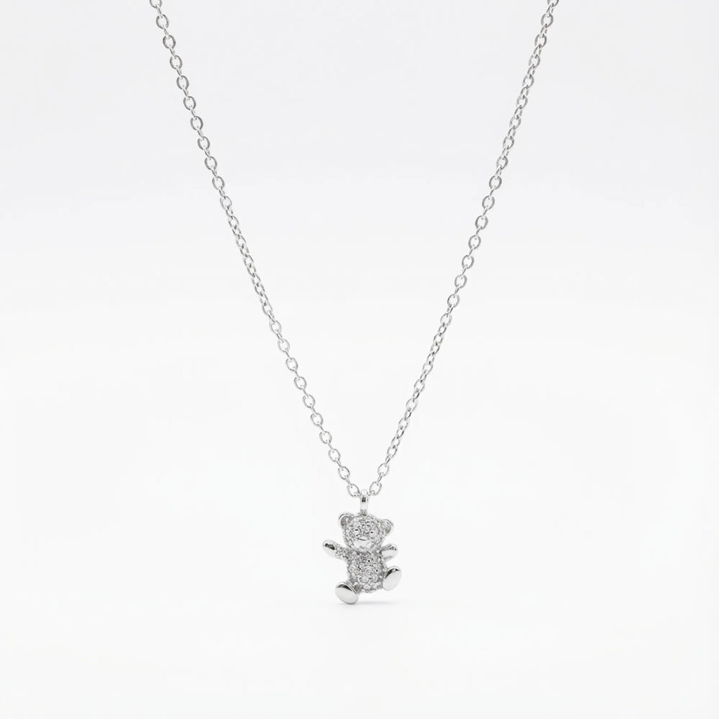Pavé CZ teddy bear pendant necklace in rhodium 925 sterling silver — full stone coverage on bear form, cable chain and lobster clasp on white background