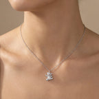 Pavé teddy bear pendant at bare collarbone — rhodium silver cable chain and fully stone-set bear form 925 sterling silver