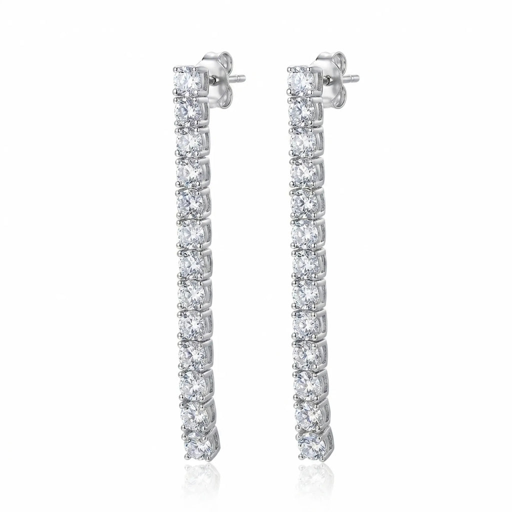 Tennis drop earrings — 40mm continuous CZ line in rhodium 925 sterling silver, four-prong setting, post back on white background