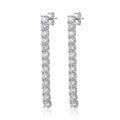 Tennis drop earrings — 40mm continuous CZ line in rhodium 925 sterling silver, four-prong setting, post back on white background