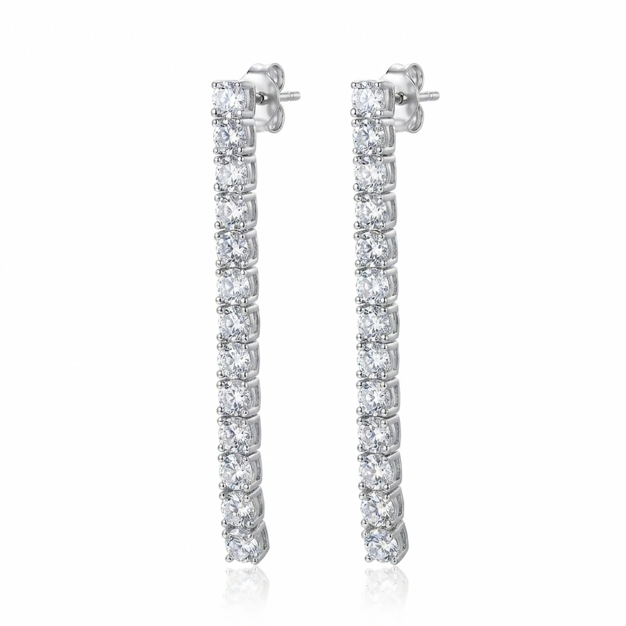 Tennis drop earrings — 40mm continuous CZ line in rhodium 925 sterling silver, four-prong setting, post back on white background