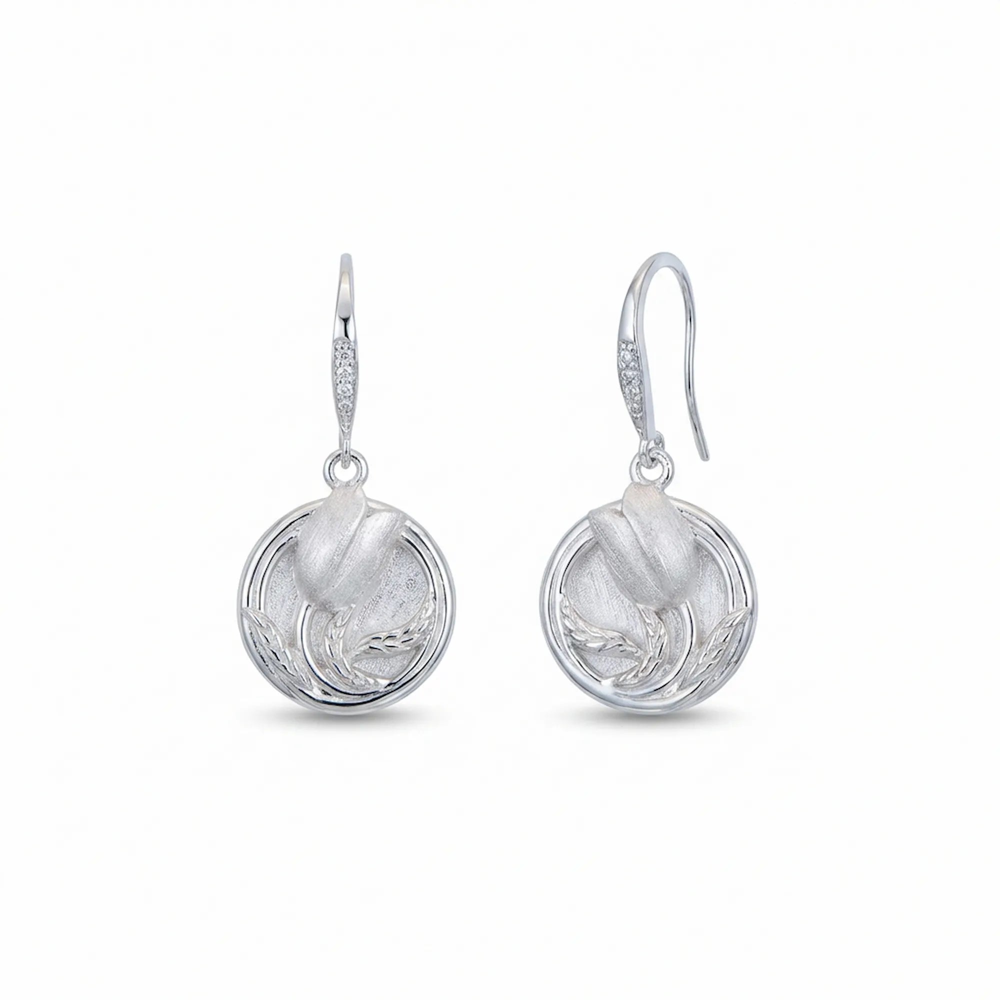 Pair of two-tone bright and brushed 925 sterling silver tulip drop earrings on white background