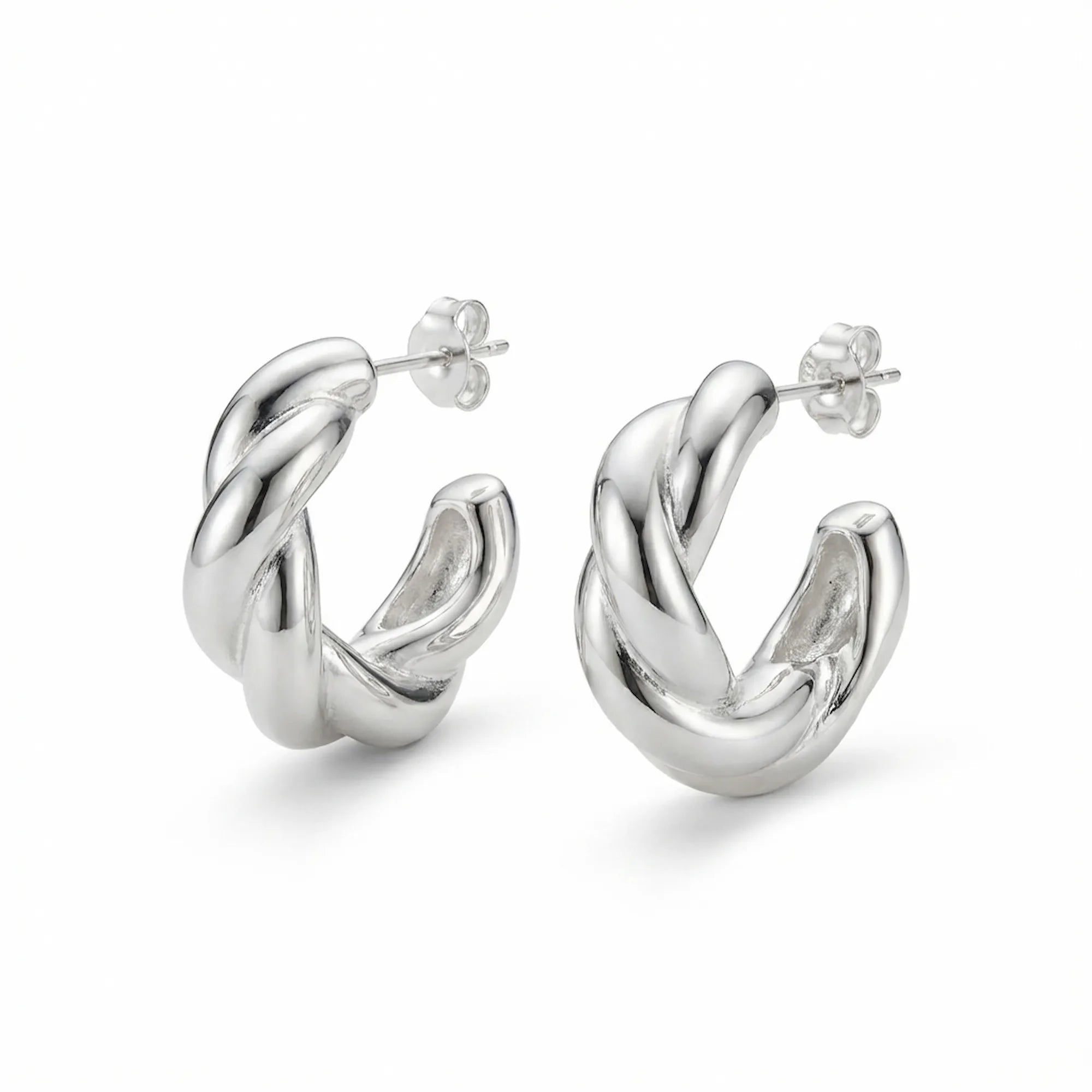 Sculptural twisted 925 sterling silver hoop earrings on white background — 15mm, post-back closure, hollow-backed form