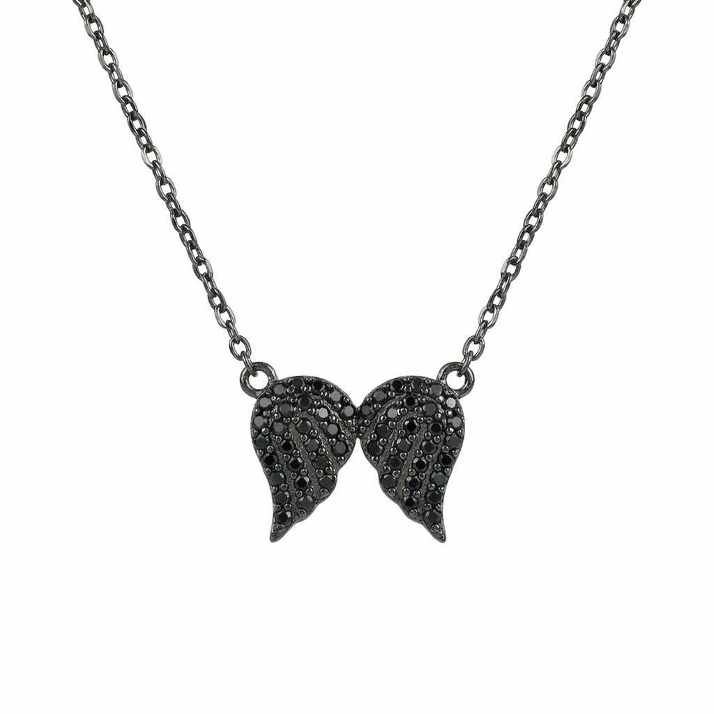 Front view of Luna Dura's women's black jewelry wing pendant in sterling silver featuring black zircon on a clean white background.