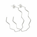 Pair of 925 sterling silver zigzag geometric hoop earrings, 50 mm, high-polish angular wire. Luna Dura.