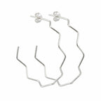 Pair of 925 sterling silver zigzag geometric hoop earrings, 50 mm, high-polish angular wire. Luna Dura.